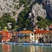 Beautiful old town of Omis with boats on the dock